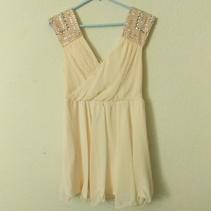Blush pink dress with sequinned cap sleeve.